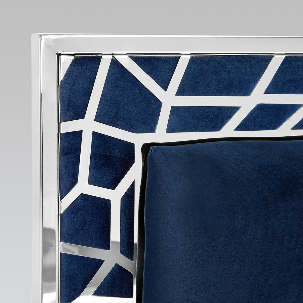 Xcella Wellington bed with blue velvet upholstery, featuring a detailed headboard and sleek design for modern bedroom decor.