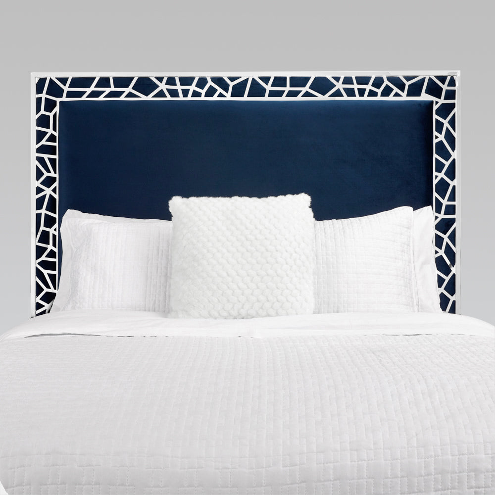 Blue velvet Wellington Bed by Xcella with a stylish upholstered headboard, shown from a front angle in a modern bedroom setting.