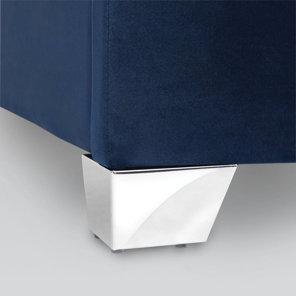 Blue velvet Wellington bed by Xcella with tufted headboard and elegant design, showcasing luxurious fabric and detailed craftsmanship.