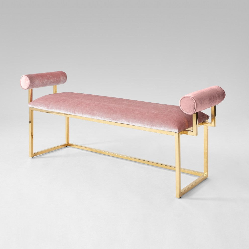 Xcella Serena Gold Bench with pink velvet upholstery, showcasing sleek design and plush seating for modern indoor decor.