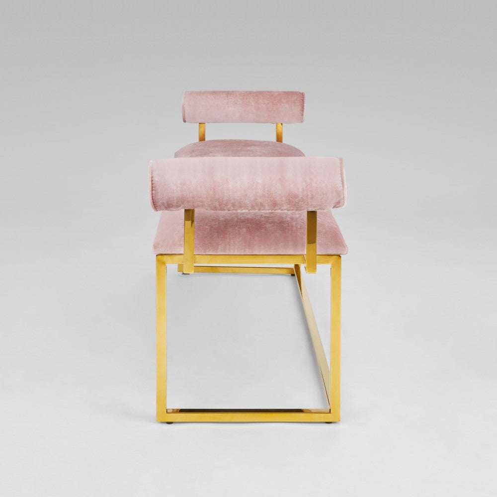 Xcella Serena Gold Bench with pink velvet upholstery, featuring a sleek modern design and gold metal legs.