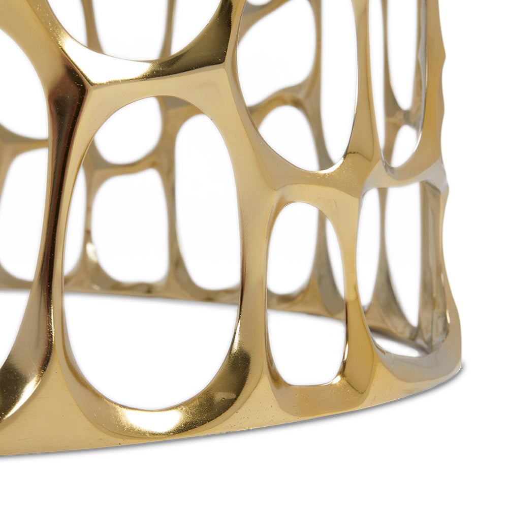 Xcella Mario marble coffee table with a gold finish, featuring a sleek, modern design and a rounded tabletop for contemporary living rooms.