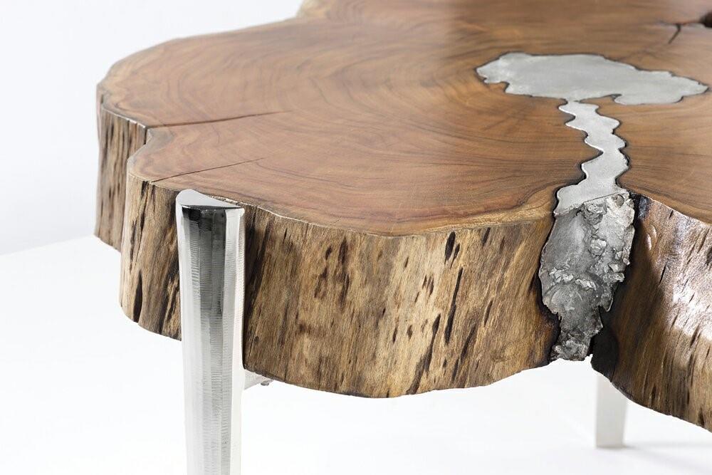 Natural wood AKIS coffee table by Xcella with a sleek, modern design, featuring smooth surfaces and sturdy legs.