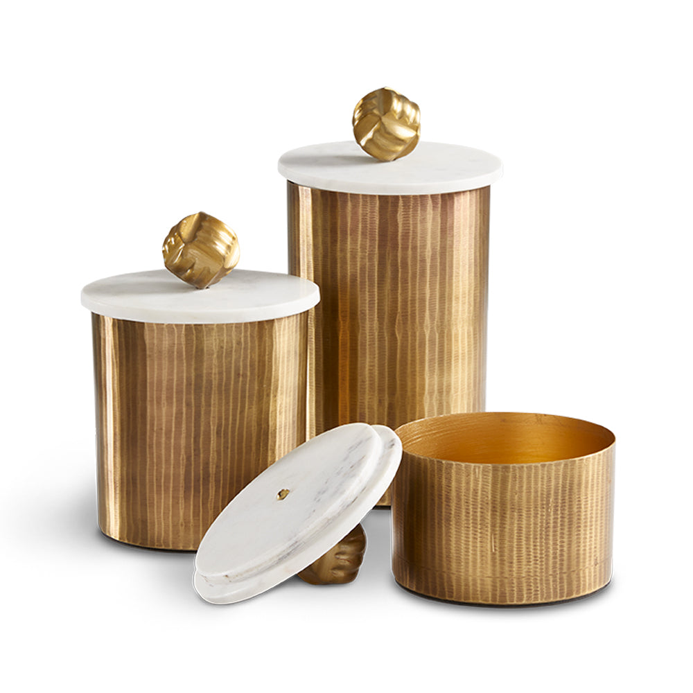 Set of three Keva matte texture decor boxes in antique brass by Xcella, featuring elegant, textured canisters for stylish storage.