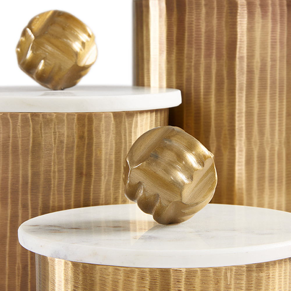 Set of three Keva matte texture antique brass decor boxes by Xcella, featuring elegant cylindrical canister designs.