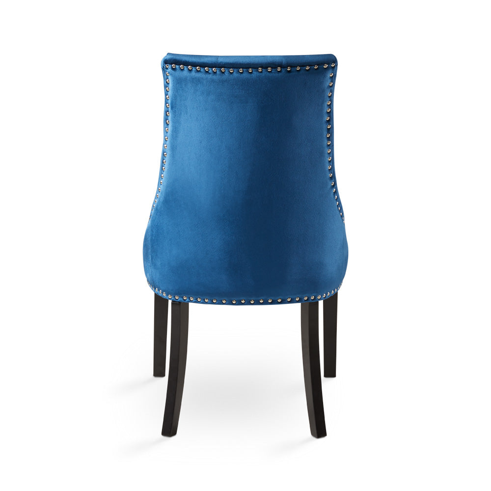 Set of two Rimzy Blue Wood Dining Chairs by Xcella featuring curved organic railwood design and cushioned seats.