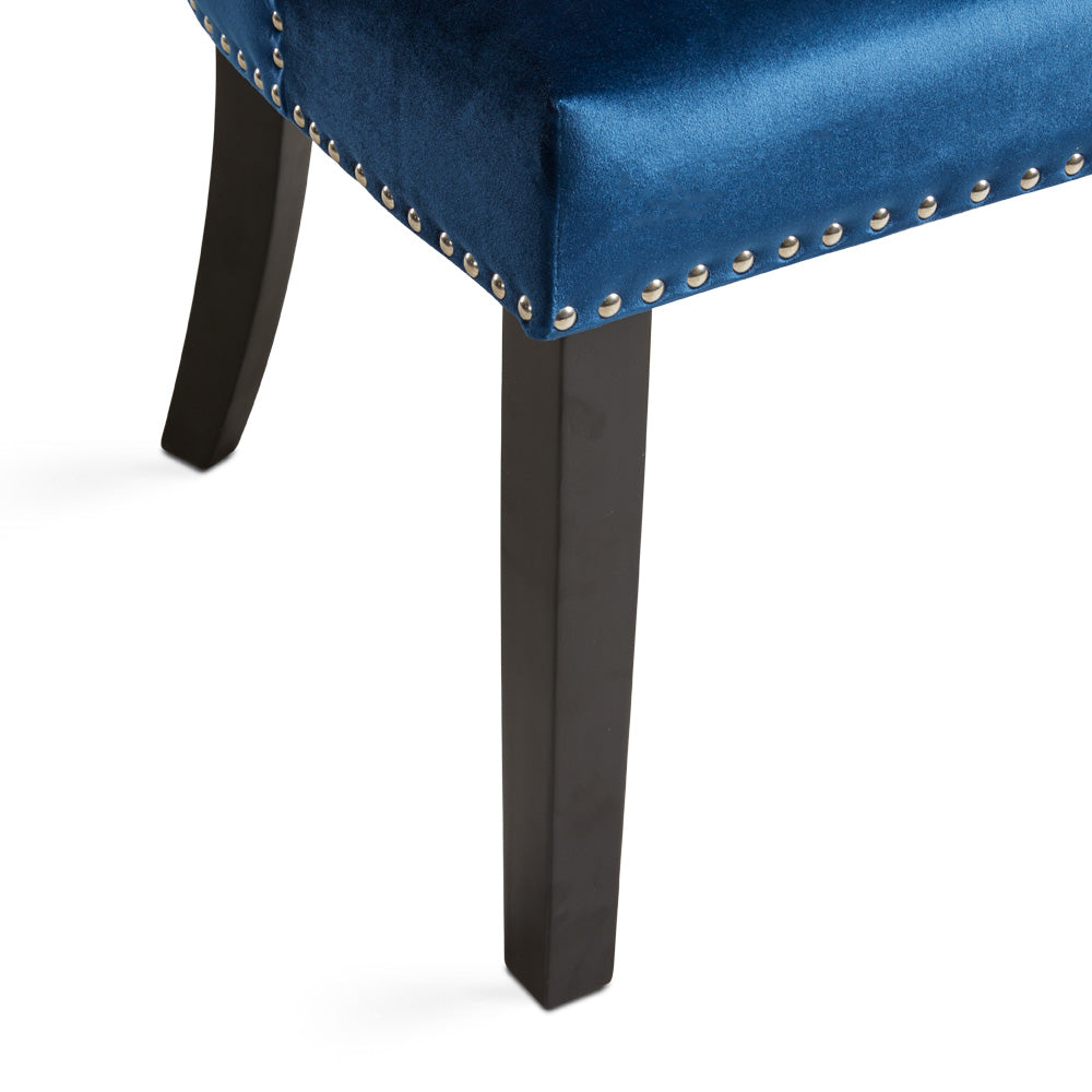 Set of two Rimzy Wood Dining Chairs in blue by Xcella, showcasing sleek wooden frames and comfortable upholstered seats.