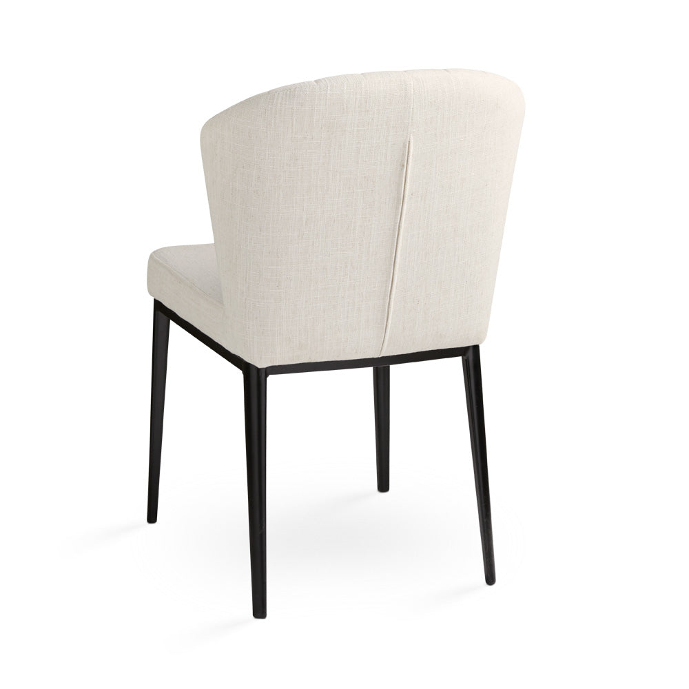 Set of two Xcella shell-shaped dining chairs in ivory with beige linen upholstery and black backs. Stylish and modern design.