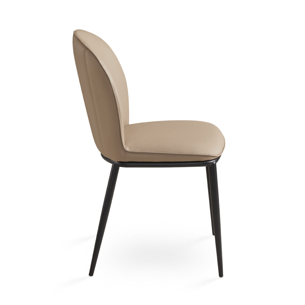 Xcella Angie dining chair with a modern design, featuring a cushioned seat and sleek wooden legs.