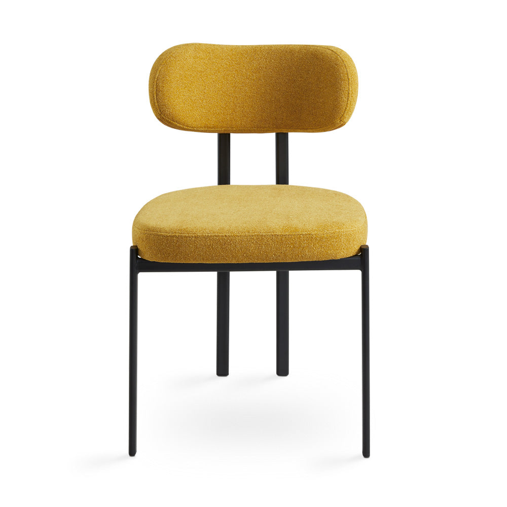 Xcella Otis dining chair in vibrant yellow mustard with sleek modern design, showing the chair's curved back and cushioned seat.