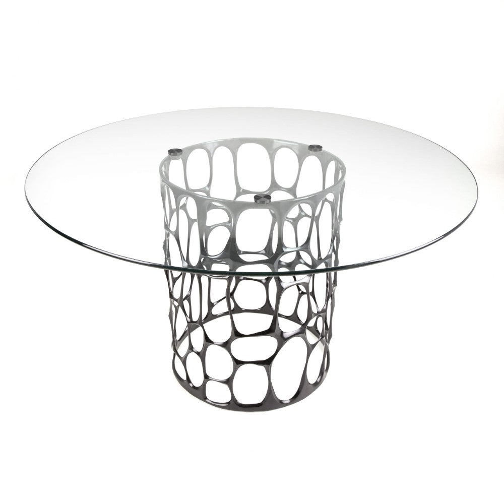 Black Mario dining table with glass top from Xcella, showcasing a sleek, modern design suitable for contemporary dining rooms.