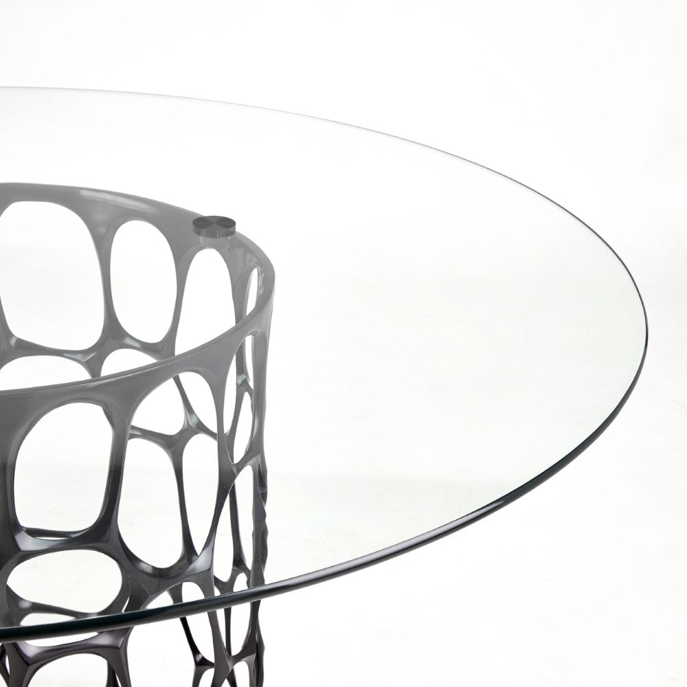 Black Mario dining table with a glass top by Xcella, modern and stylish for contemporary dining spaces.