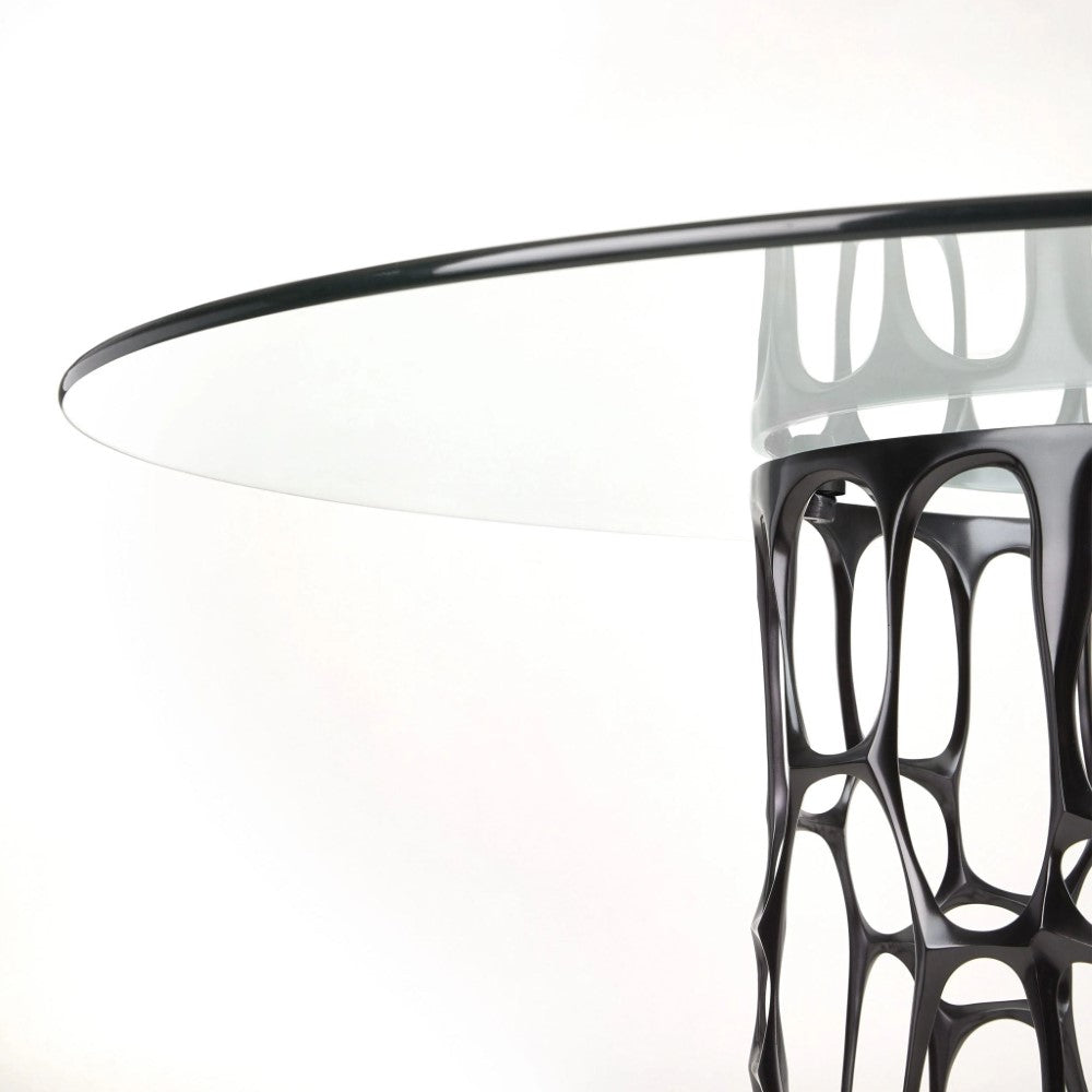Black Mario dining table with glass top by Xcella, showcasing a modern and sleek design for contemporary dining spaces.