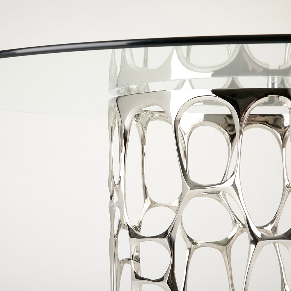 Black Mario dining table by Xcella, modern dining table with sleek black finish, shown in a contemporary dining room setting.