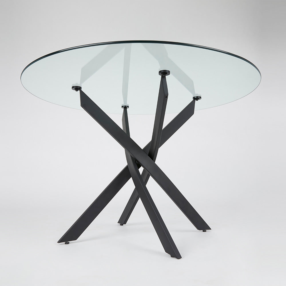 Xcella Carol black metal dining table with sleek tabletop and modern design, perfect for contemporary dining spaces.