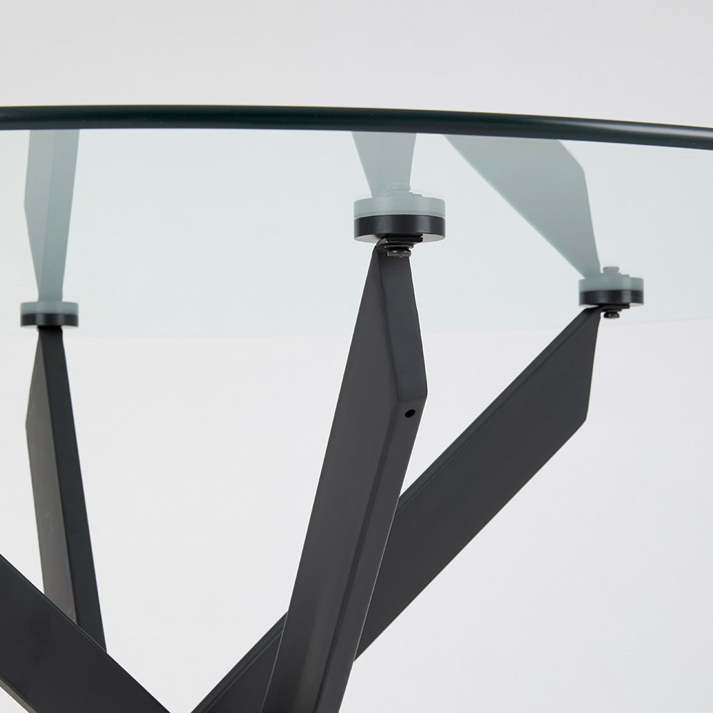 Xcella Carol dining table with black metal legs and a smooth wooden tabletop, perfect for modern dining rooms.