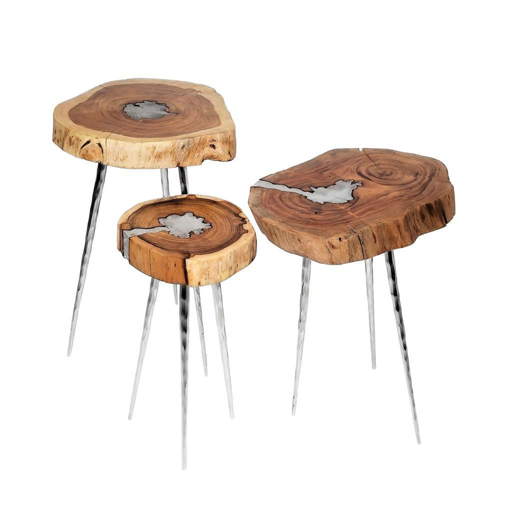Set of three AKIS side tables by Xcella, modern end tables with sleek designs in a stylish indoor setting.