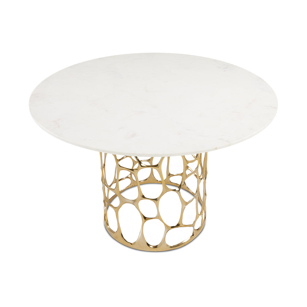 Xcella Mario marble dining table with gold base, high-angle view showing polished marble surface and elegant kitchen and dining room design.
