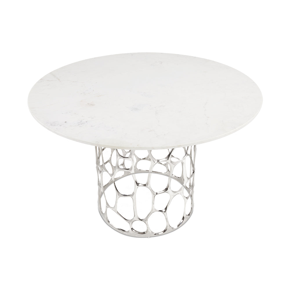 Xcella Mario marble dining table with silver base, high-angle view showcasing sleek tabletop for kitchen and dining room.
