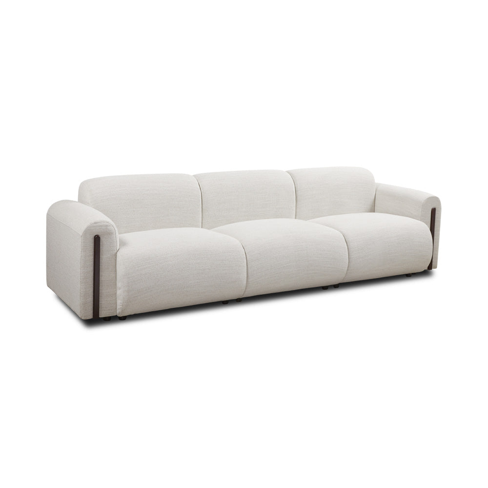 Xcella Designers Collection Brenton 4-seater sofa with plush cushions and modern design, seen from a three-quarter angle.